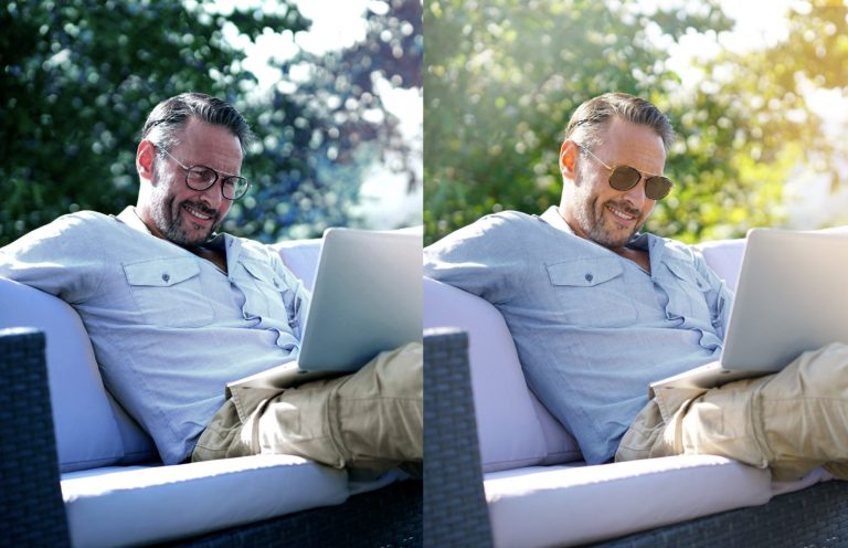 Mann mit Sonnenbrille sitzt entspannt mit Laptop auf einer Couch im Freien.